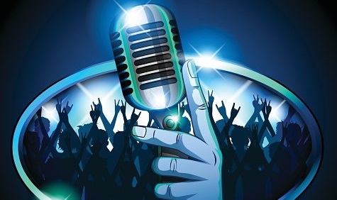 98568575-hand-holding-retro-mic-microphone-in-front-of-huge-crowd